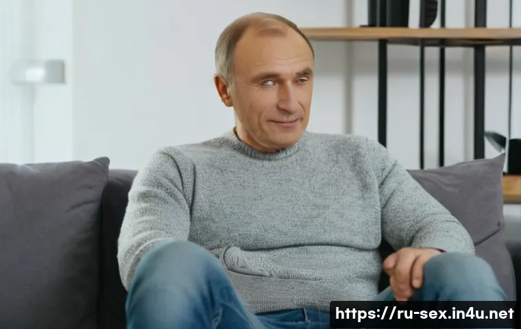 성교육과 남성 인권 - A thoughtful middle-aged Russian man sitting in a cozy modern living room, dressed casually in a fit...